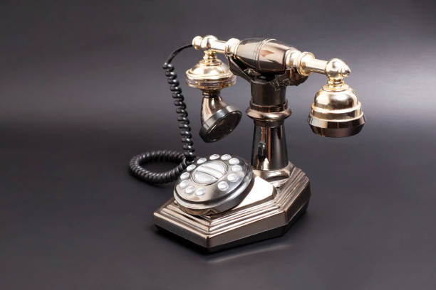 istock Vintage telephone on black background. 1765264919