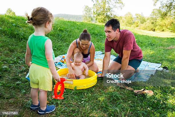 Young Family Having Picnic In Nature Stock Photo - Download Image Now - Adult, Boys, Car Safety Seat