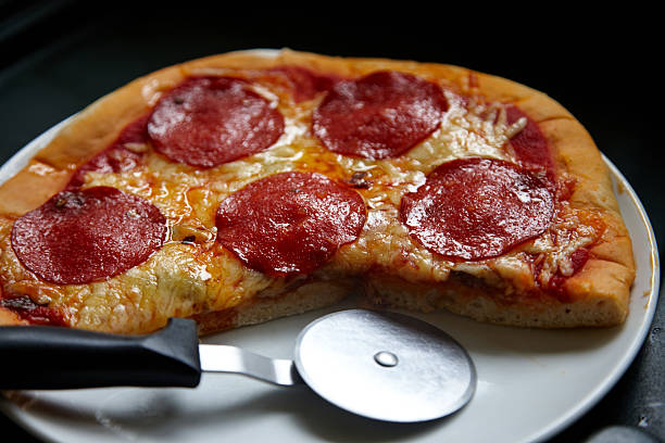 istock Homemade Pepperoni pizza with cutter 176528005