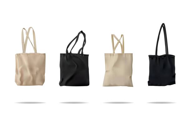 Tote bag mockup. Canvas shoppers, black and white eco bags cloth for grocery shopping, cotton fabric. Empty packaging collection. 3d isolated handbag for purchase. Vector fashion template Tote bag mockup. Canvas shoppers, black and white eco bags cloth for grocery shopping, cotton fabric. Empty packaging collection. 3d isolated ecological handbag for purchase. Vector fashion template tote bag mock up stock illustrations
