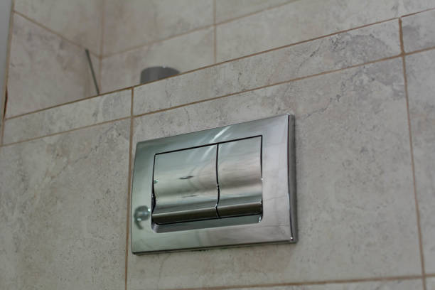 istock Modern Dual button for flushing in the hotel bathroom. Selective focus, shallow depth of field 1765287528