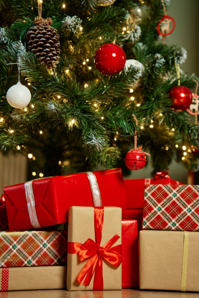 istock Presents under fir tree for Christmas holiday 1765292376