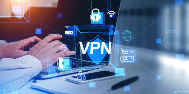 istock Man using laptop and smartphone, VPN and secure connection hologram 1765297422