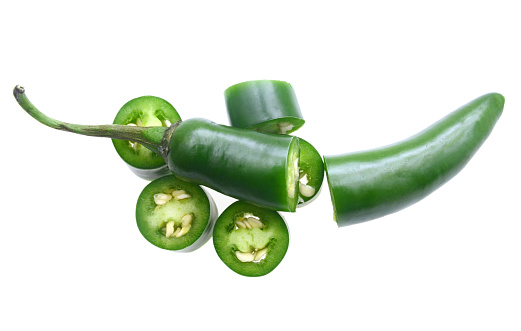 Green serrano chilli with cut on white