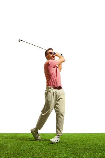 On vibrant, emerald fairway, golfer's flawless form and meticulous technique radiate expertise, painting picture of grace and control. Concept of game, sport, recreation, active lifestyle. Copy space.