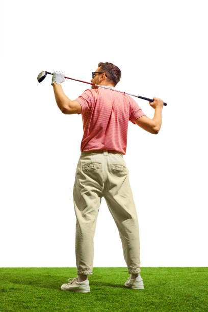 Back view. Professional golfer hit sweeping driver after hitting golf ball down fairway at golf club. Hobby in holiday and vacation with friends. Concept of game, sport, recreation, healthy lifestyle.