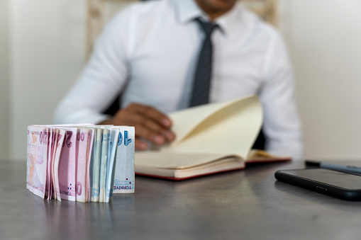 Businessman counting Turkish money.