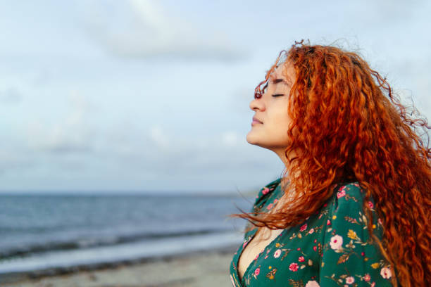 istock Woman breathing fresh air outside. 1765342291