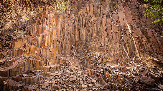 Basalt, volcanic rocks known as the Organ Pipes, Twyfelfontein in Damaraland, Namibia.  Horizontal.