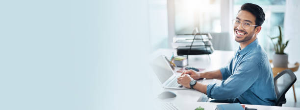 istock Business man, laptop and portrait for information technology, software development and banner or mockup. Happy face of asian employee or IT expert with solution on computer for startup tech company 1765368917
