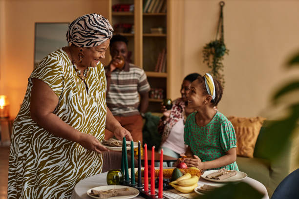 istock Grandmother Bringing Plates to Table 1765389732
