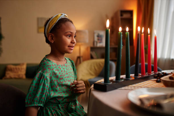 Black Girl Looking at Colorful Candles