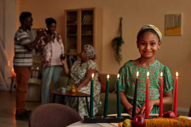 istock Girl Standing at Candle Holder 1765389773