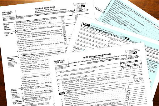 2023 tax forms lay on a desk.