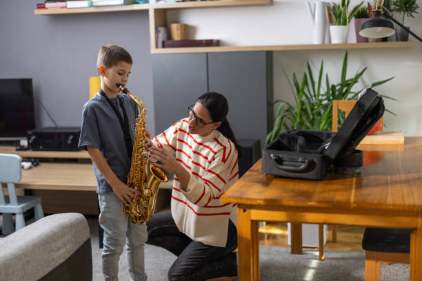 istock Young saxophonist with teacher 1765400953