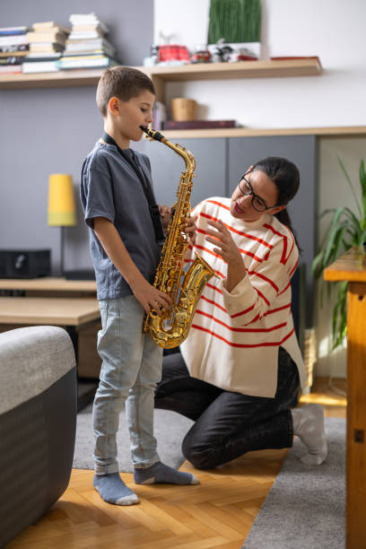 istock Young saxophonist with teacher 1765401466