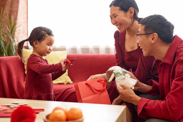 istock Celebrating Chinese new year together and exchanging presents 1765418020