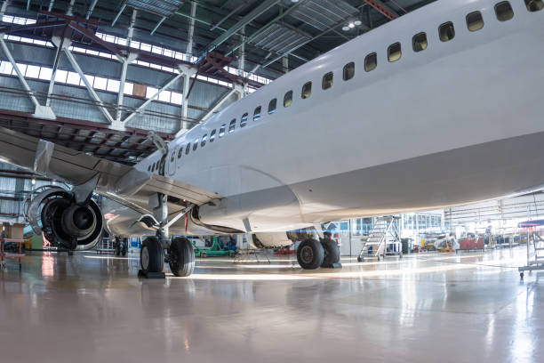 istock White passenger jet plane in the aviation hangar 1765419744