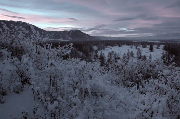 istock Cold snowy mountain landscape at sunset. 1765419766