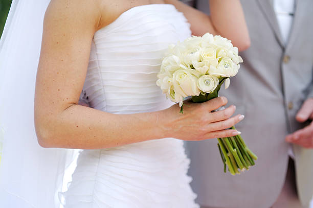 istock Bride holding beautiful wedding bouquet 176543376