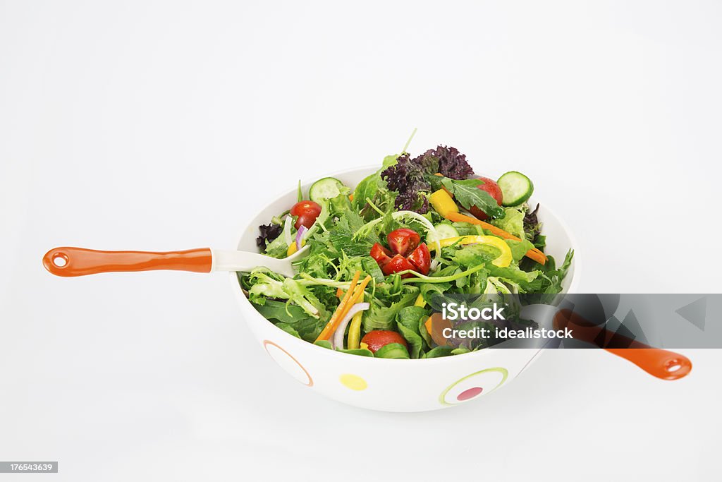 Fresh Salad Healthy green salad, in white bowl. Isolated on white background. Appetizer Stock Photo