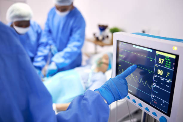 istock Monitor, surgery and doctors team doing heart operation for emergency organ treatment or healing anatomy in hospital. Rescue, medical and professional surgeon or healthcare teamwork collaboration 1765441769