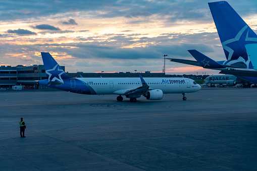 An Air Transat airplane parking at Pearson International Airport - the primary international airport serving Toronto, Golden Horseshoe.