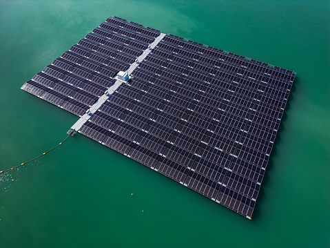 Floating solar park with photovoltaic system on the lake as aerial view
