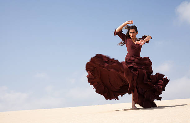 flamenco in the dunes Flamenco dancer in the long dress in the dunes flamenco dancing photos stock pictures, royalty-free photos & images