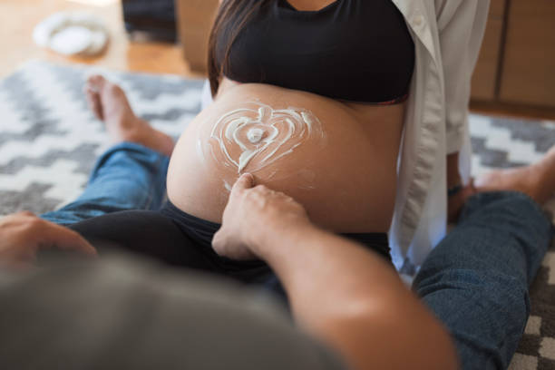 beautiful european happy family with a pregnant mother, the father and a son together. High quality photo