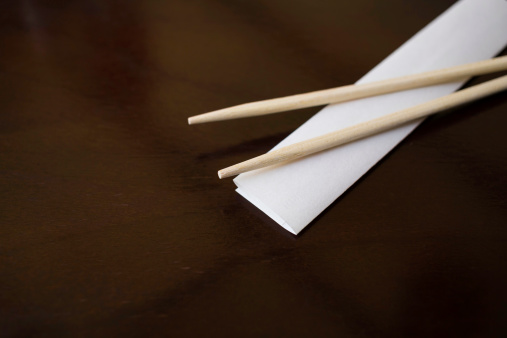a pair of chopsticks on a table at a restaurant