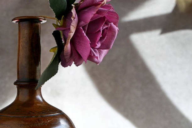 istock red rose in a wooden vase 1765462268