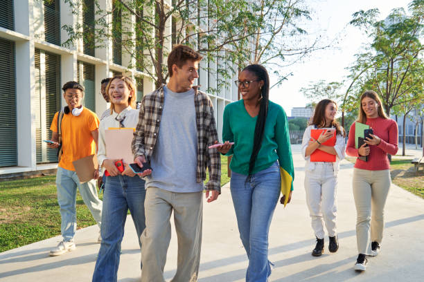 istock Group of multiethnic students walking going to classroom at university. 1765462273
