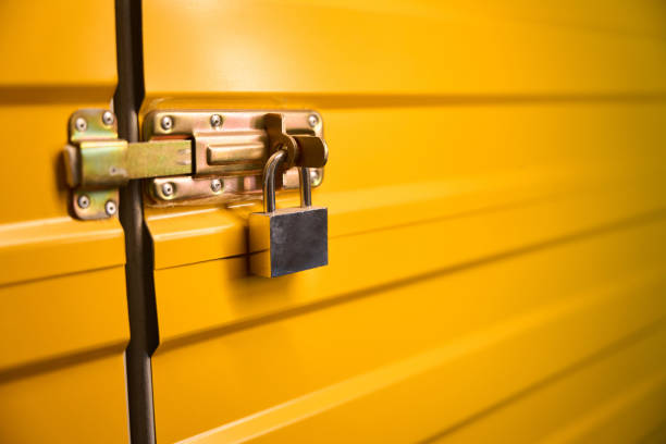 istock Yellow metal door with a lock 1765467988