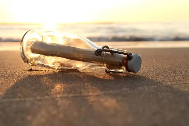 message in a bottle stranded on the beach