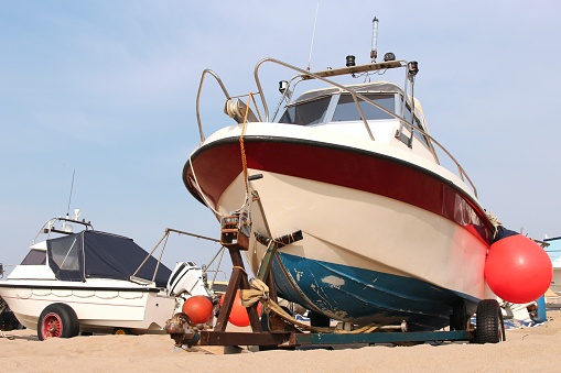 motorboat on trailer at sandy beach