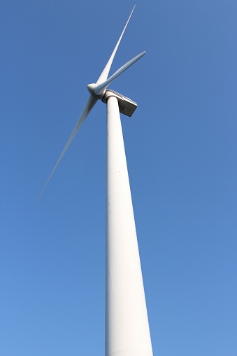 wind turbine against blue sky