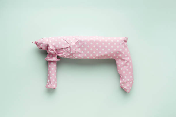 istock Creative men's gift concept. Electric drill wrapped in pink polka dot gift paper on a blue pastel background. 1765474682