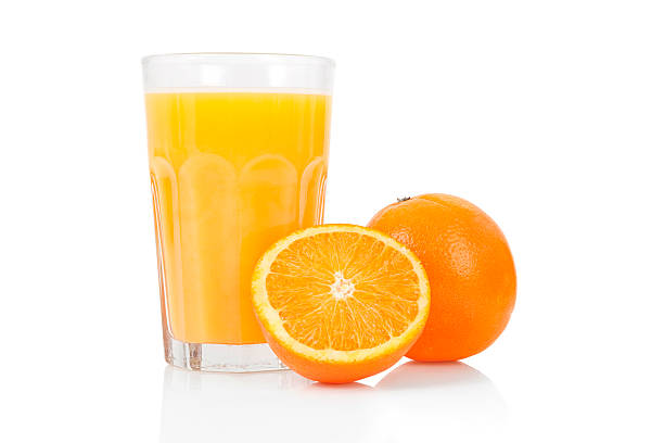 Fresh Orange Juice Picture of organic orange juice beside fresh oranges. orange juice stock pictures, royalty-free photos & images