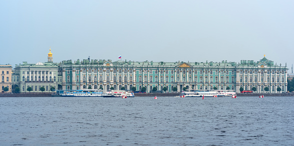 Saint Petersburg, Russia - August 04, 2023: view of the Small Hermitage and Winter Palace from the Neva River