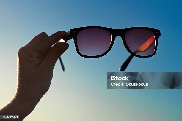 Backlit Hand And Sunglasses 01 Stock Photo - Download Image Now - Adolescence, Adult, At The Edge Of