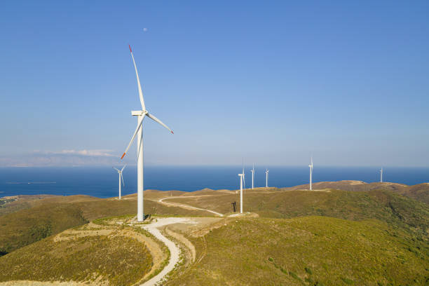 istock Electrical wind turbines in mountains on sea coast 1765500655