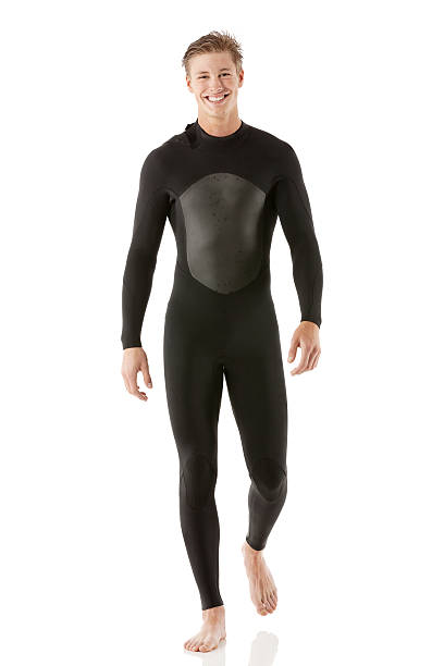 Smiling male surfer Smiling male surferhttp://www.twodozendesign.info/i/1.png wetsuit stock pictures, royalty-free photos & images