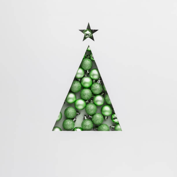 istock Creative concept for Christmas and New Year. Christmas tree in triangle shape with light green Christmas tree balls on gray background. 1765520095