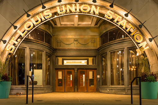 Union Station, St. Louis, MO - USA: Oct. 21, 2023 - Lighted entryway of historic Union Station in St. Louis at night. St. Louis Union Station spelled out in illuminated letters. Head-on perspective.