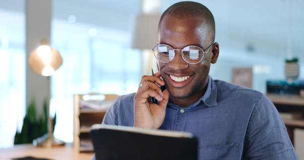 istock Businessman, black man and tablet with thinking, networking and planning in modern office with glasses. Face, african person and touchscreen for reading, technology and digital marketing at workplace 1765529413