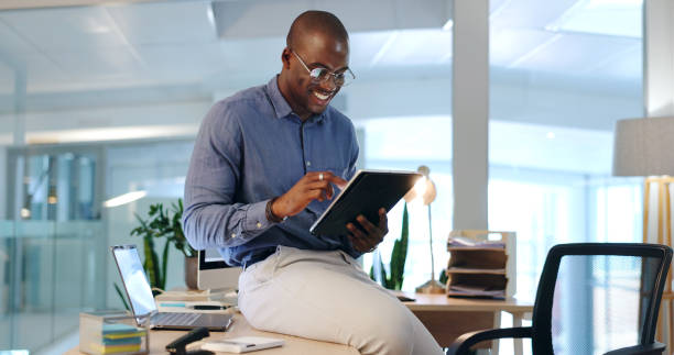 istock Smile, business and black man in office on tablet for web design ideas, online project and website. Networking, corporate and happy male worker on digital tech for research, planning and strategy 1765529417