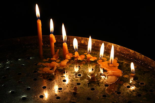 istock row of bright burning church candles 176553280