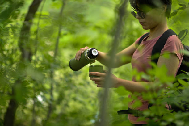 istock young lady walking in the forest 1765537847