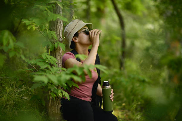 istock young lady walking in the forest 1765555977